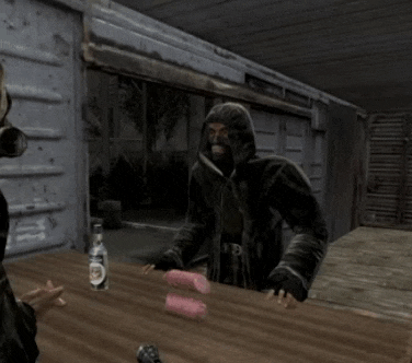 a man in a gas mask is standing in front of a wooden table