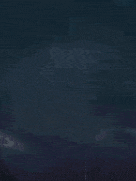 a silhouette of a spider is floating in the air