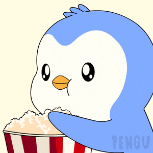 a penguin eating popcorn from a striped bucket
