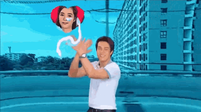 a man in a white shirt is holding a woman 's face in his hands