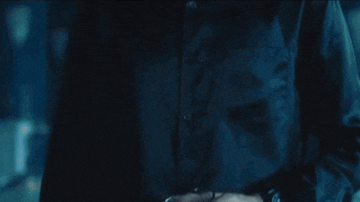 a close up of a person 's torso in the dark