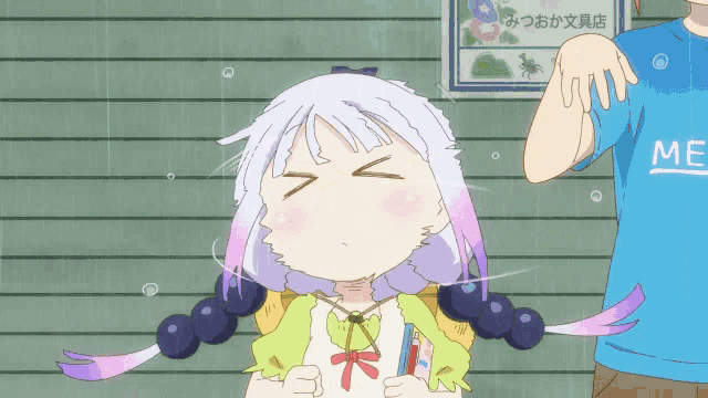a person wearing a blue shirt that says me stands next to a girl