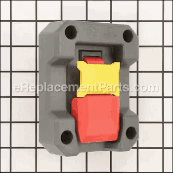 a red and yellow switch is sitting on top of a checkered table .