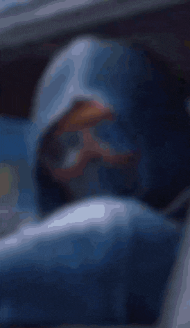 a close up of a person wearing goggles and a mask on their face .