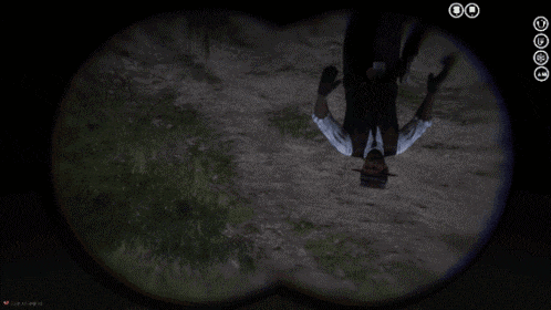 a man in a suit and hat is upside down in the dark
