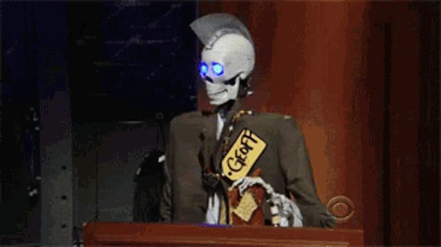a skeleton wearing a tag that says geoff