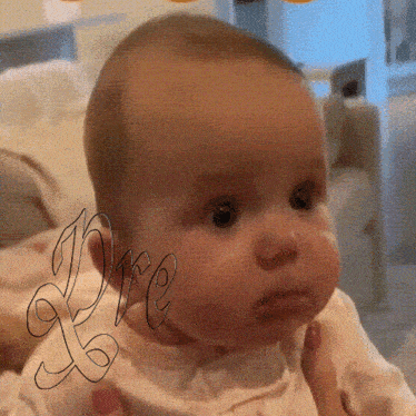 a baby is being held by a person and the word love is on the bottom right