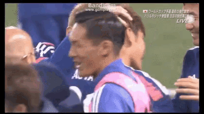a group of soccer players are huddled together and the words bandicam are on the screen
