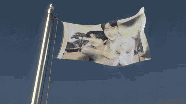 a flag with a picture of two young men on it