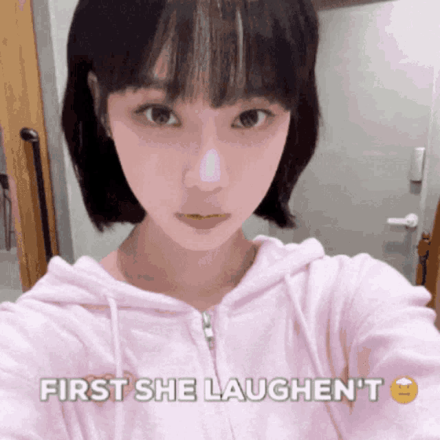 a girl taking a selfie with the words first she laughen 't below her
