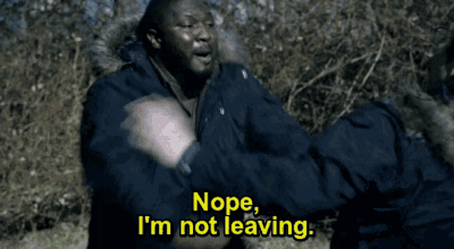 a man says nope i 'm not leaving in yellow letters
