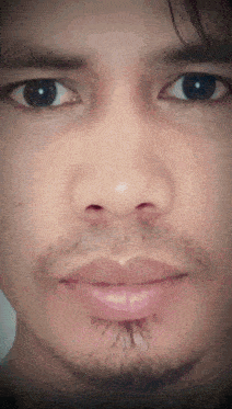 a close up of a man 's face shows his eyes and mouth