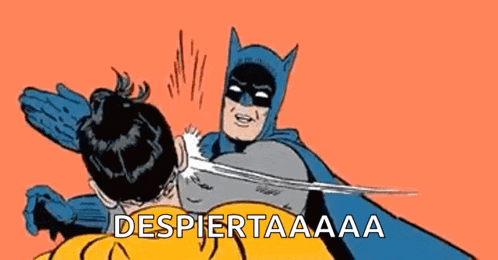 a cartoon of batman slapping robin on the face with the words despiertaaa written below it .
