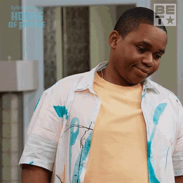 a man wearing a shirt that says tyler perry 's house of fame