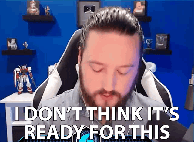 a man with a beard is sitting in a gaming chair and says i don t think it 's ready for this