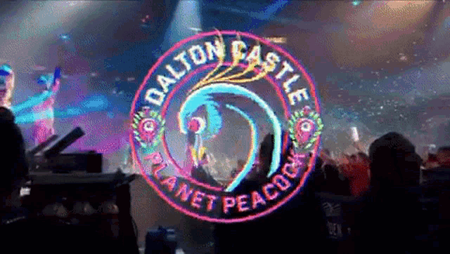 the dalton castle planet peacock logo is projected onto a stage