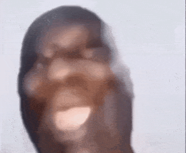 a blurry picture of a person 's face with a huge smile on it .