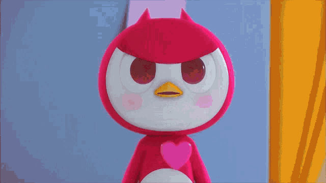 a pink stuffed animal with a yellow beak is standing in front of a yellow curtain