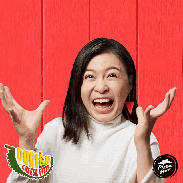 a woman making a funny face in front of a durian cheese pizza ad