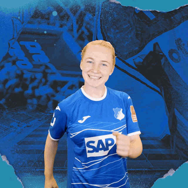 a woman wearing a blue shirt that says sap on it