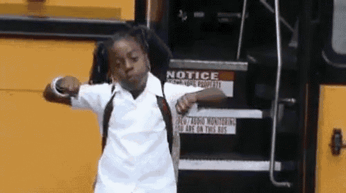a little girl is standing in front of a school bus with a notice sign on the side of it