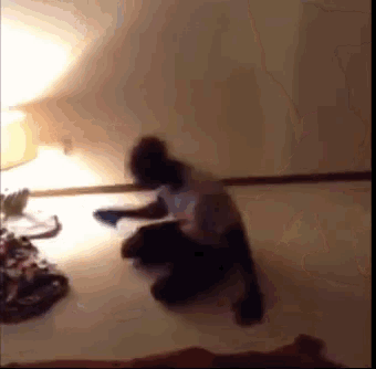 a blurry picture of a person kneeling down on the floor