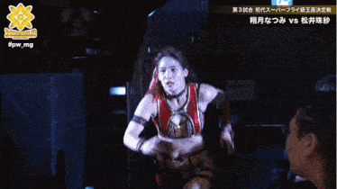 a woman in a wrestling outfit stands in front of a man in a black shirt that says ncw