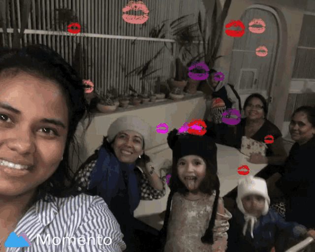 a group of people are posing for a picture and the words momento are on the bottom right