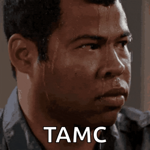 a man is sweating with the word tamc written on his face