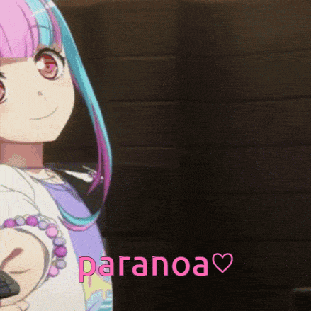 a girl with pink and blue hair is holding a remote control with the word paranoa written in pink