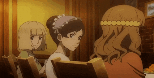 three anime girls are sitting at a table and one has a maid 's headband on her head