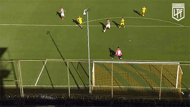 a soccer game is being played with the letters lfe on the corner