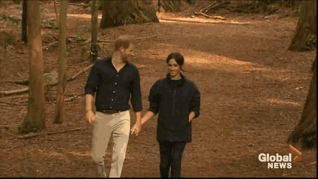 prince harry and meghan markle are walking through the woods on a global news channel