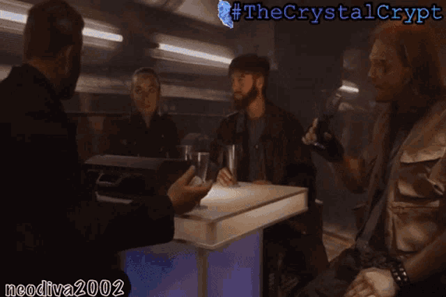 a group of people sitting at a table with the crystal crypt written on the top
