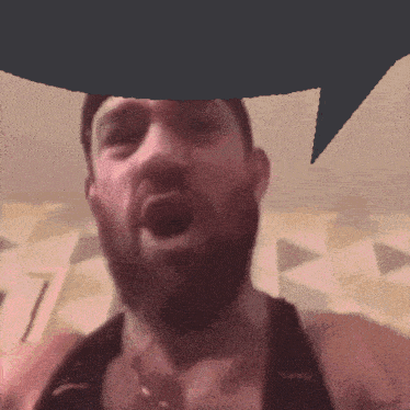 a man with a beard has his mouth open and a speech bubble above his head