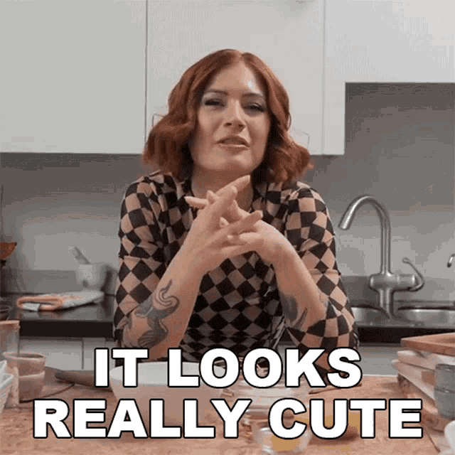 a woman in a checkered shirt says it looks really cute in a kitchen