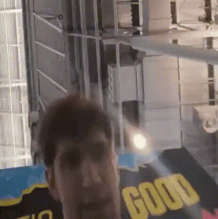 a person is standing in front of a sign that says good on it