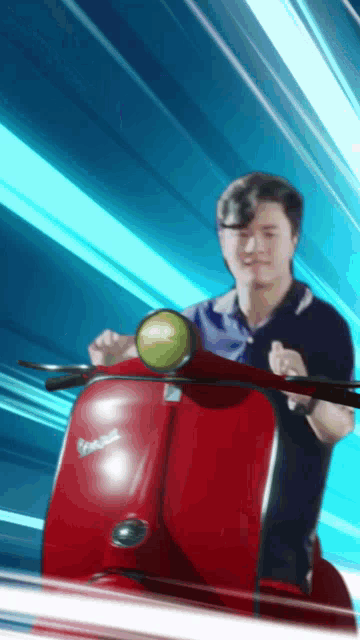 a man is riding a red vespa scooter with a blue background