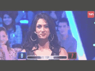 a woman is on a tv show and the number 8 is on the screen