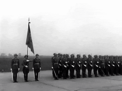 a black and white photo of a group of soldiers