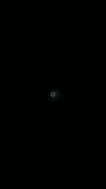 a dark background with a white circle in the middle of it