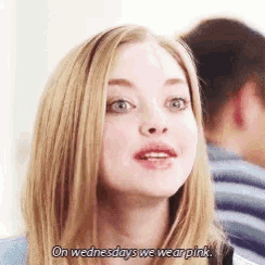 a woman with blonde hair is wearing pink on wednesdays