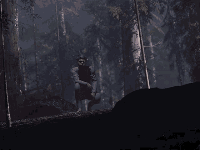 a man sitting on a log in a forest