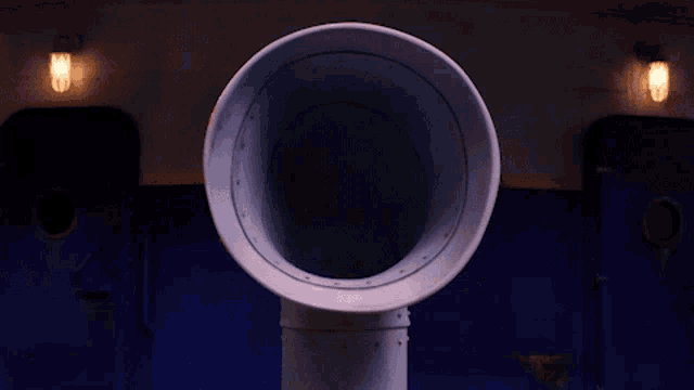 a cartoon character with a mustache is sticking his tongue out of a pipe