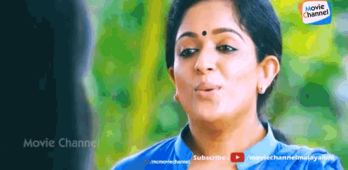 a woman in a blue shirt is making a funny face on a movie channel advertisement