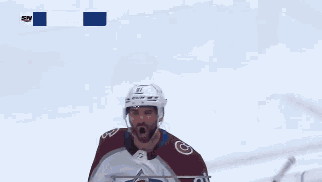 a hockey player with the number 91 on his shirt