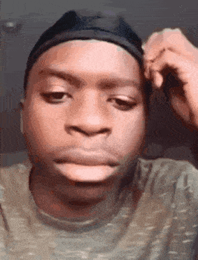 a close up of a man wearing a headband