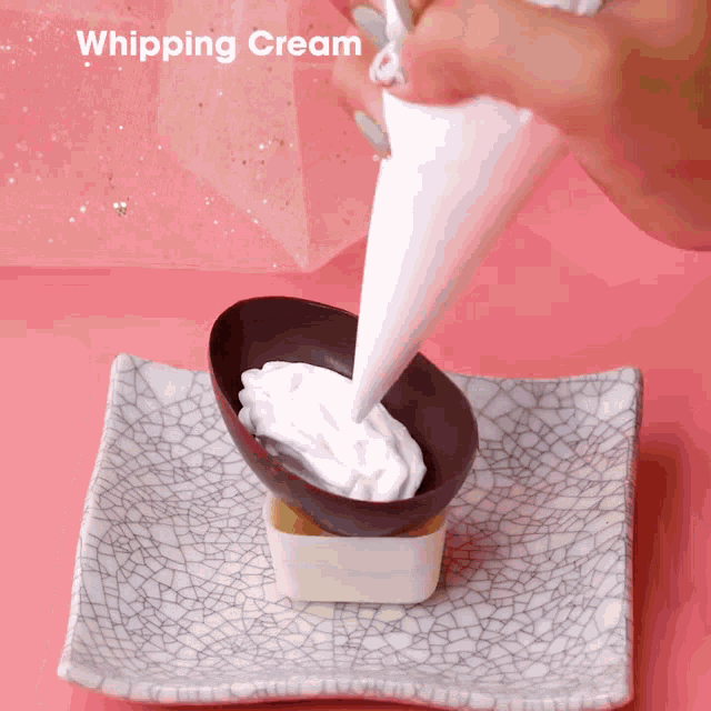a person is whipping cream into a chocolate cup