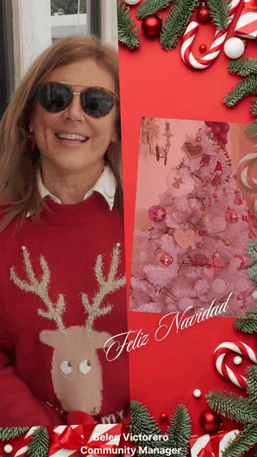 a woman wearing a red reindeer sweater is surrounded by christmas decorations