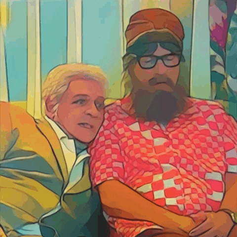a man with a beard and glasses sits next to another man
